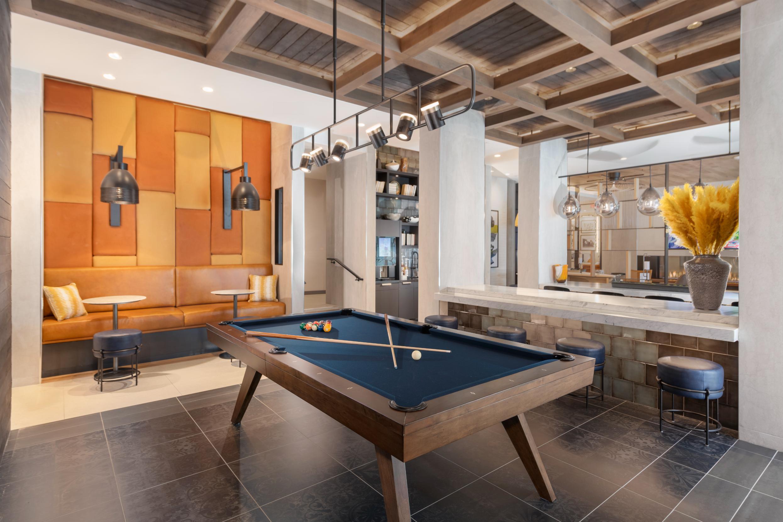 Social lounge featuring an exhibition kitchen, bar area and billiards room.