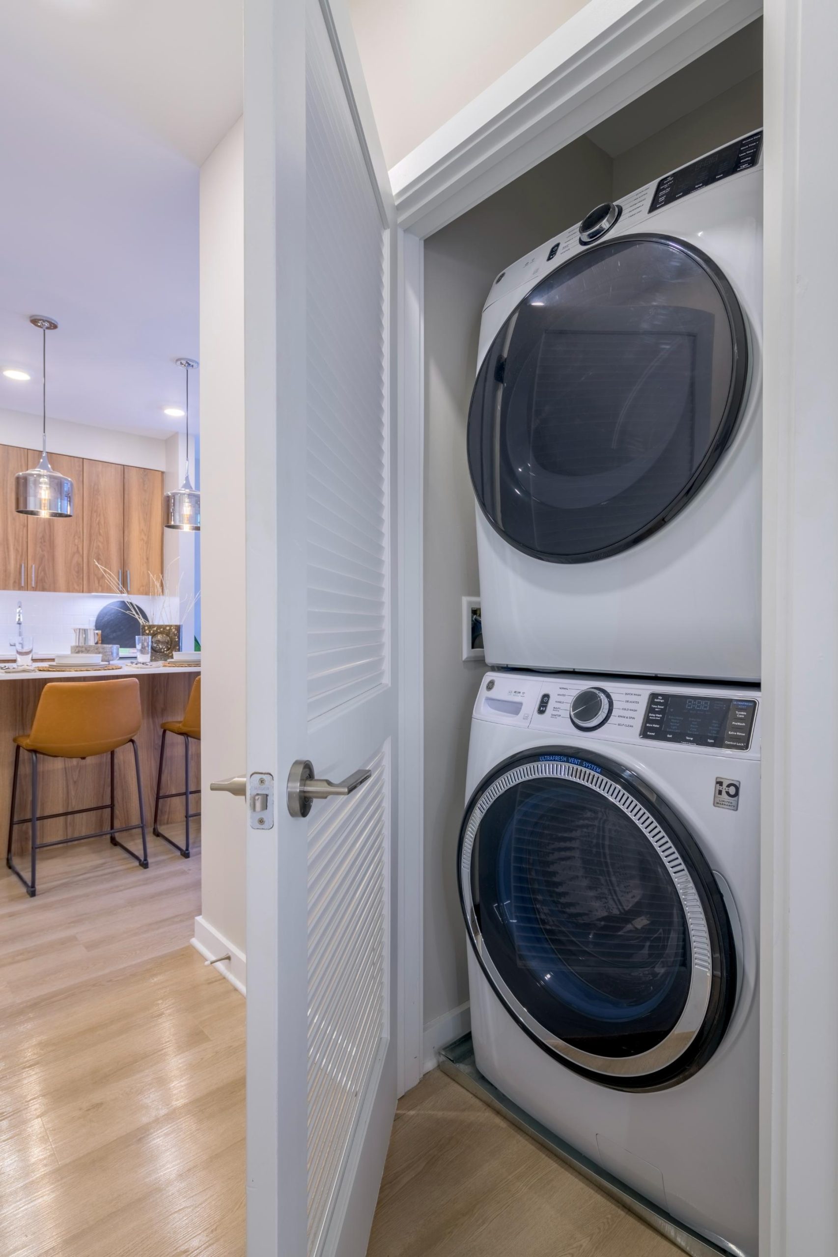 Inclusive washer and dryer hidden behind closet doors 